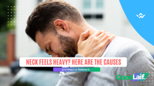 Man holding the back of his neck because his neck feels heavy and stiff from muscle tension