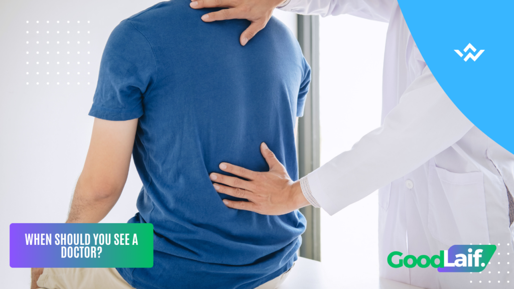 Man holding his lower right back due to right side lower back pain