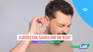Man holding his ear due to a clogged ear