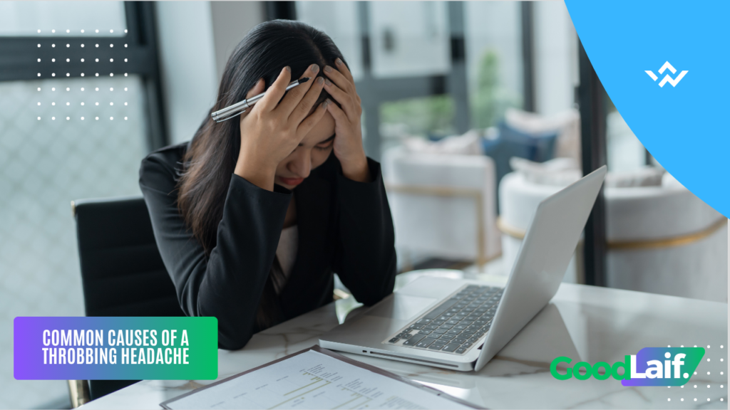 Person holding head with both hands due to a throbbing headache