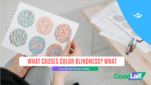 Hand holding an Ishihara color blindness test sheet to check what causes color blindness