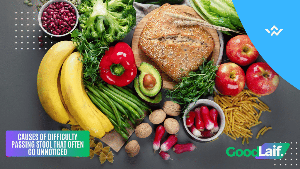 Illustration of high-fiber foods like fruits, vegetables, and whole grain bread related to causes of difficulty passing stool
