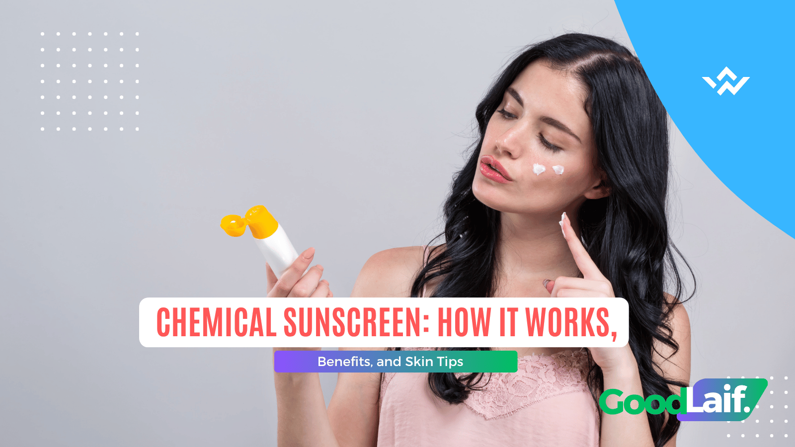 Woman holding a tube of chemical sunscreen while pointing up to explain how it works and its benefits