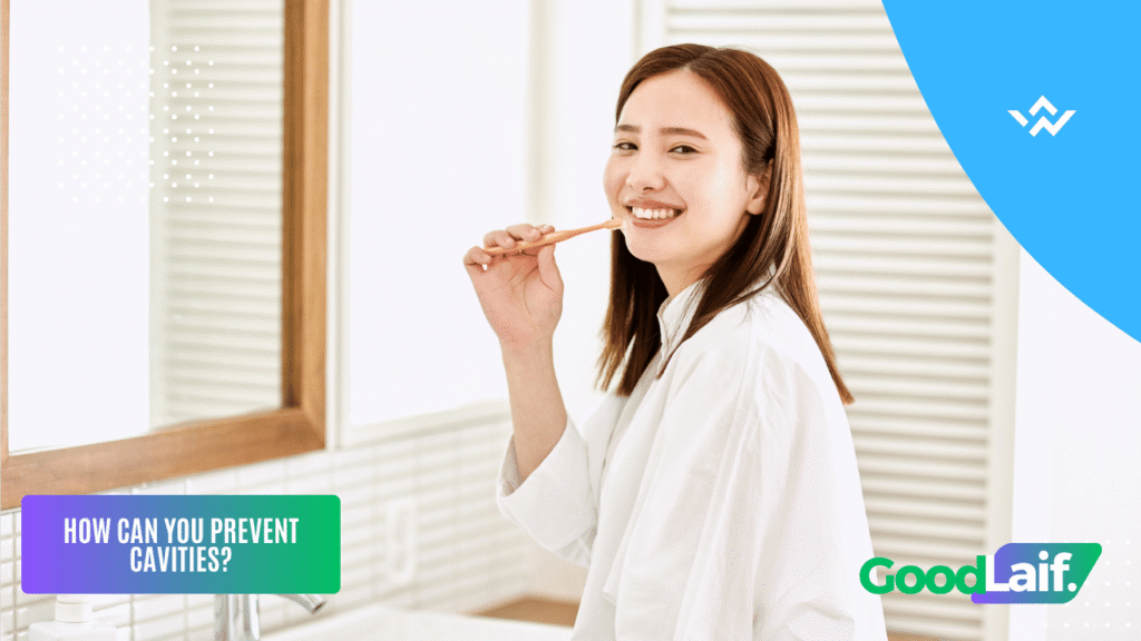 Illustration of a woman smiling while brushing her teeth to prevent the causes of cavities
