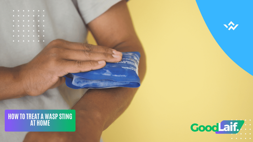 Person applying a cold compress to a swollen arm to treat a wasp sting at home