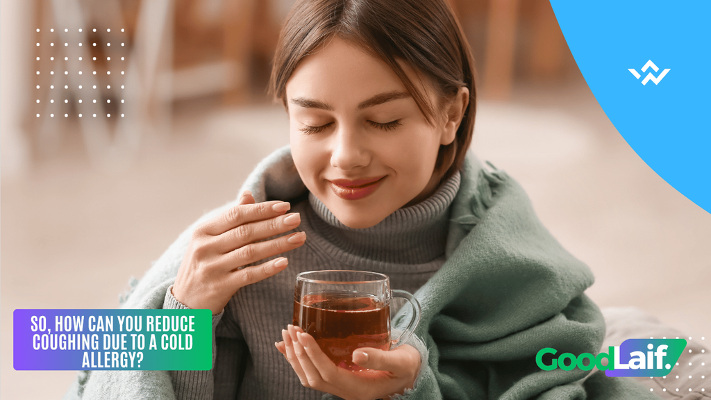 A woman drinking warm tea while wrapped in a blanket to relieve coughing due to a cold allergy